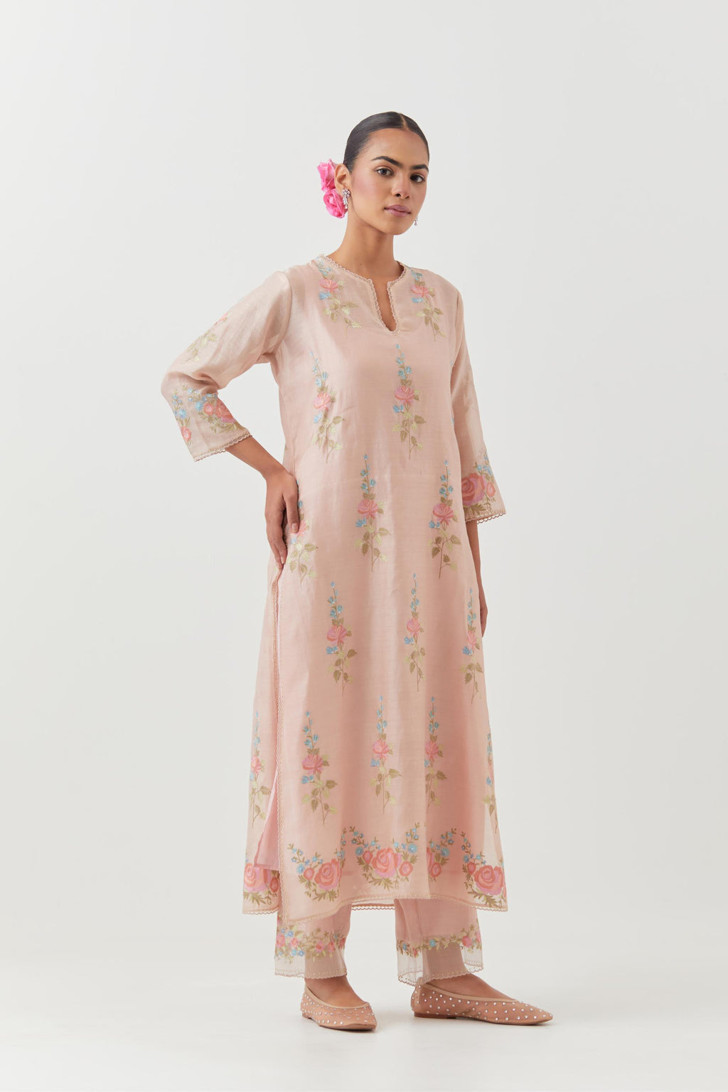 Pink silk Chanderi straight kurta set with all-over rose embroidery and scalloped organza detail at the edges.