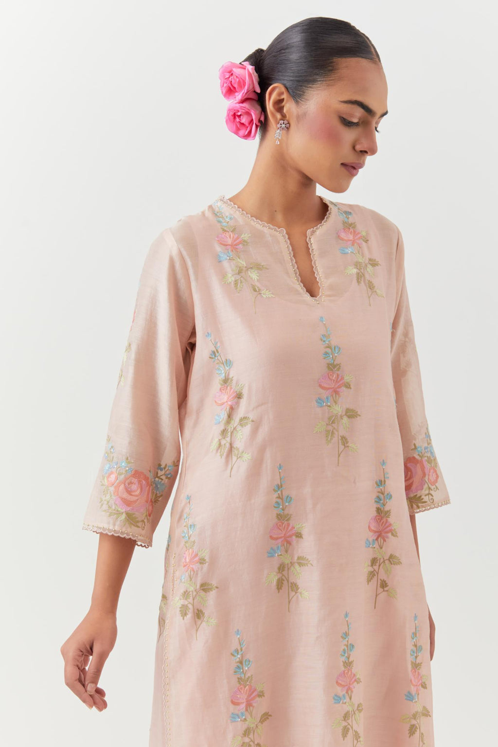 Pink silk Chanderi straight kurta set with all-over rose embroidery and scalloped organza detail at the edges.