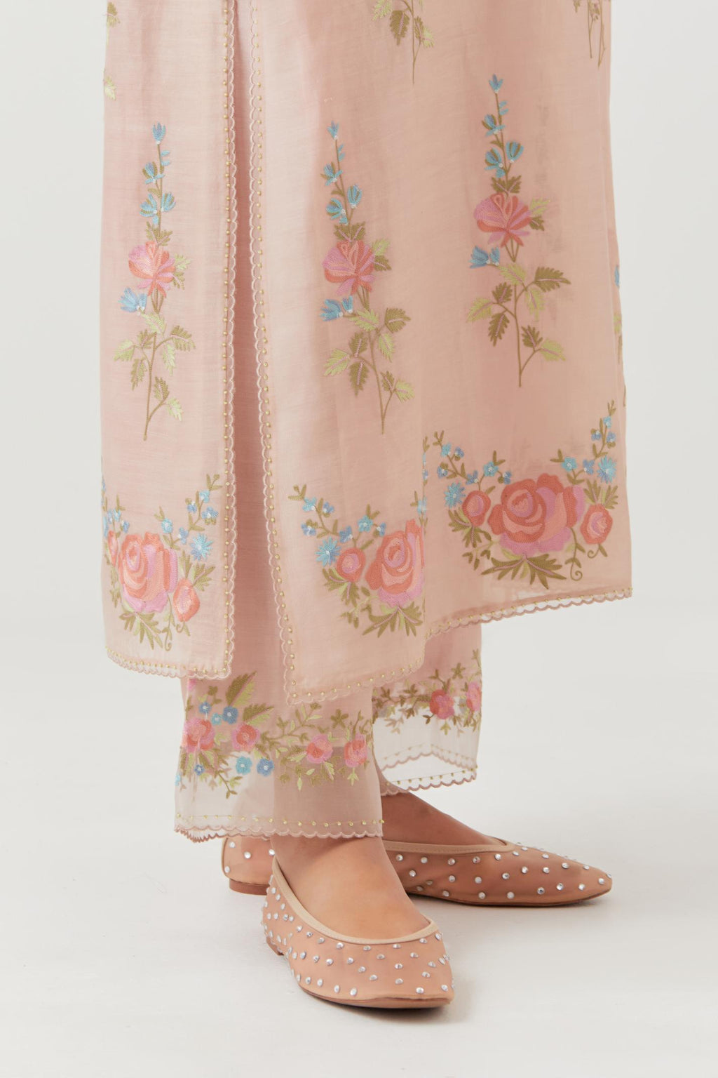 Pink silk Chanderi straight kurta set with all-over rose embroidery and scalloped organza detail at the edges.