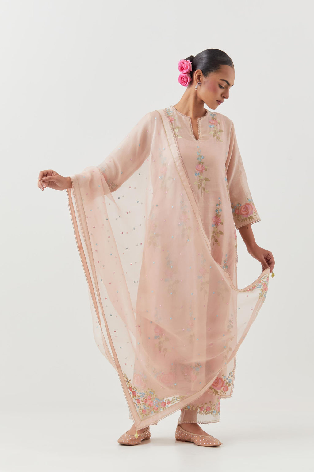 Pink silk Chanderi straight kurta set with all-over rose embroidery and scalloped organza detail at the edges.