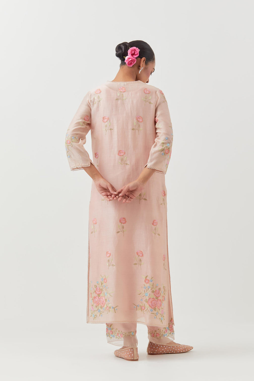 Pink silk Chanderi straight kurta set with all-over roses embroidered in thread and scalloped organza detail at the edges.