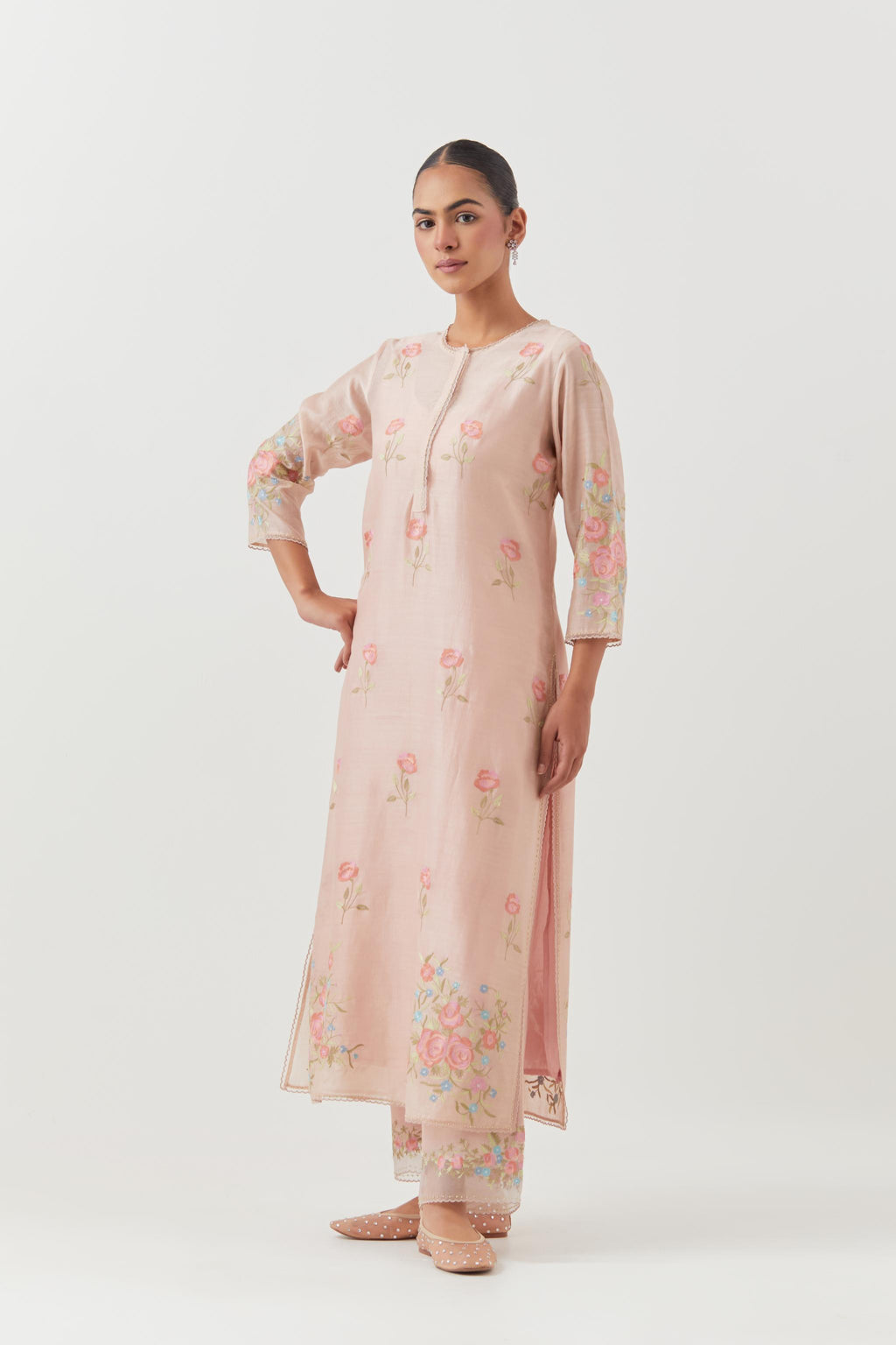 Pink silk Chanderi straight kurta set with all-over roses embroidered in thread and scalloped organza detail at the edges.