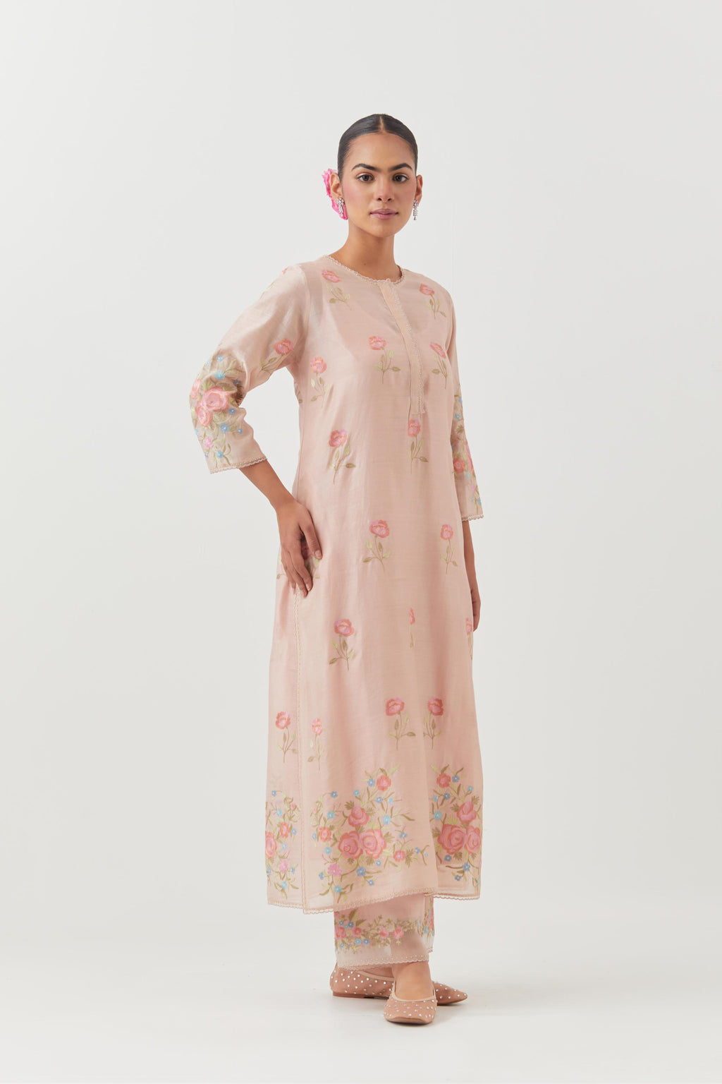 Pink silk Chanderi straight kurta set with all-over roses embroidered in thread and scalloped organza detail at the edges.