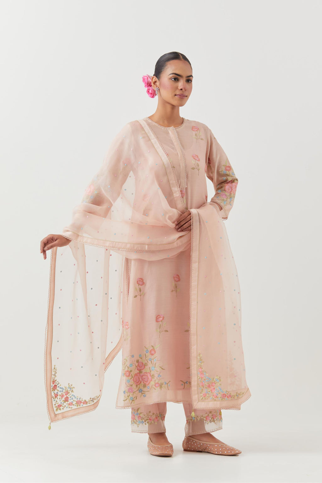 Pink silk Chanderi straight kurta set with all-over roses embroidered in thread and scalloped organza detail at the edges.