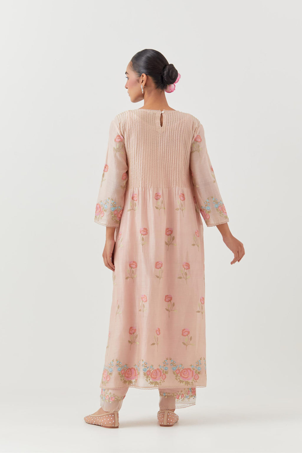 Pink silk chanderi kurta set with pin tucks at yoke and all-over rose flower embroidery.