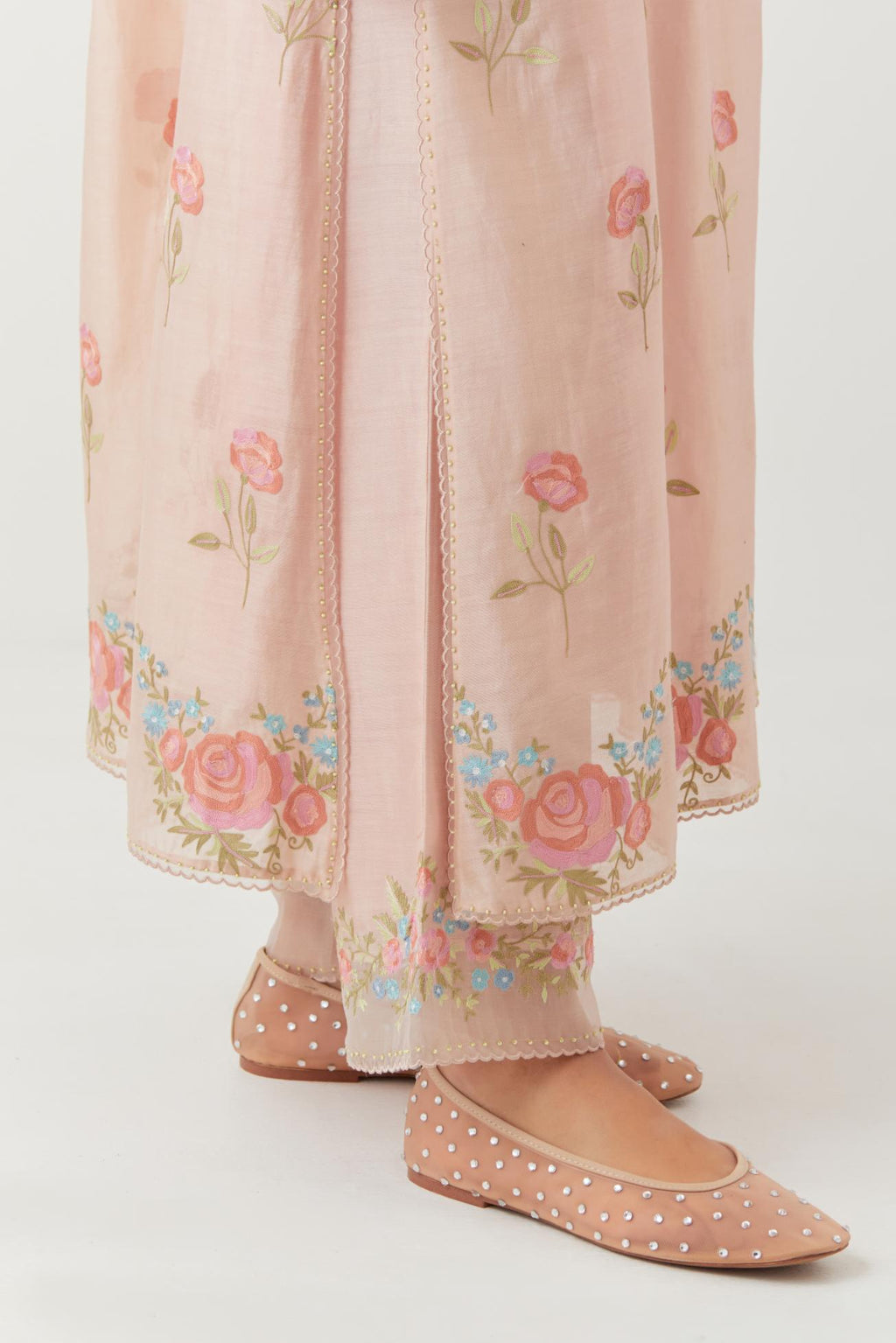 Pink silk Chanderi straight kurta set with all-over roses embroidered in thread and scalloped organza detail at the edges.