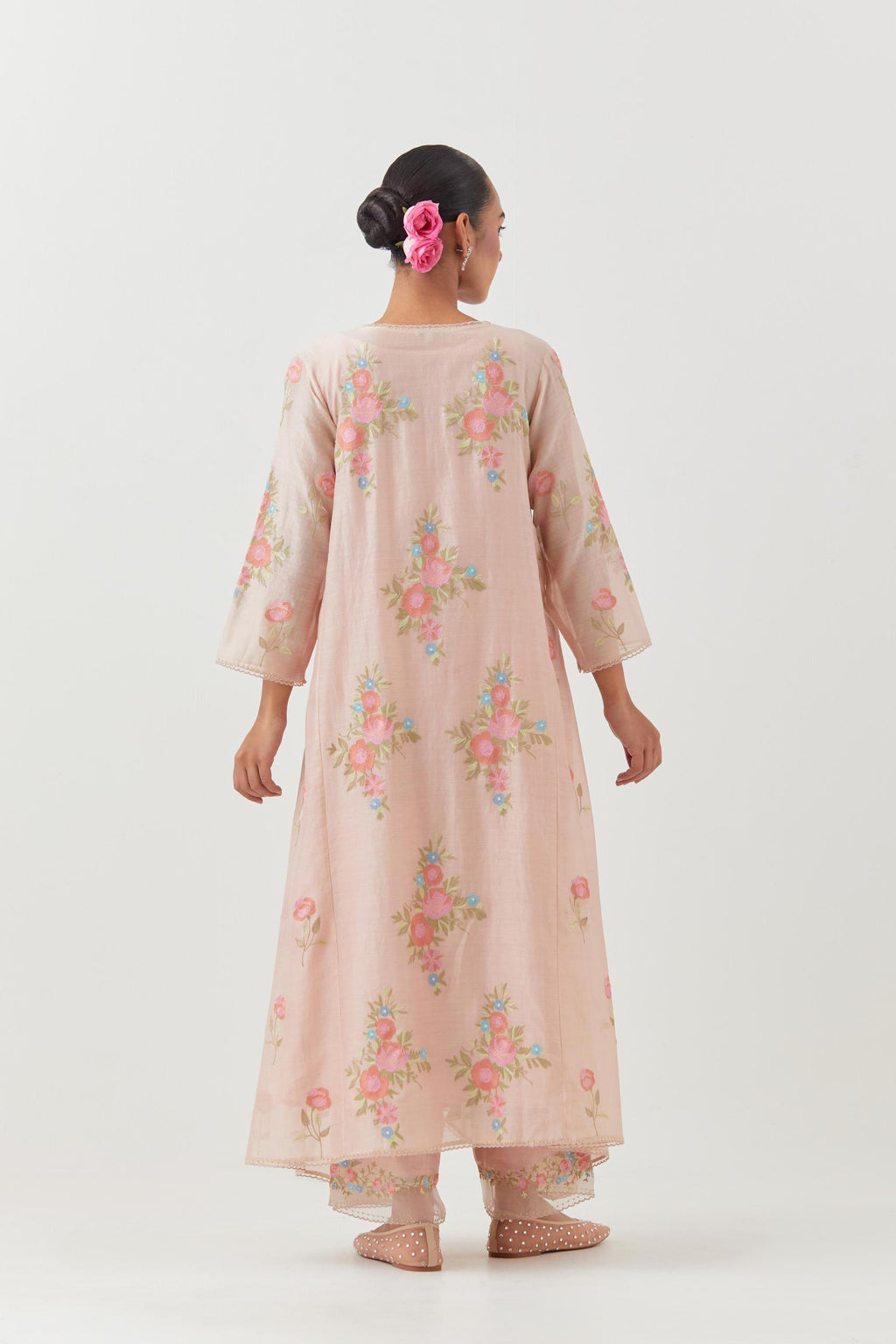 Pink silk chanderi easy fit, asymmetric hem, paneled kurta set with all-over thread embroidered roses, highlighted with scalloped organza at the edges with contrast beads.