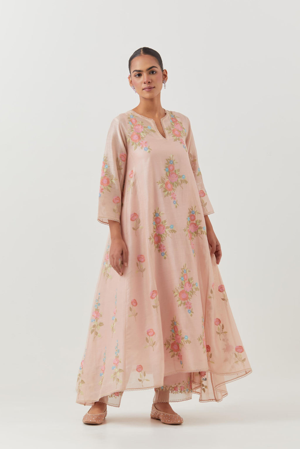 Pink silk chanderi easy fit, asymmetric hem, paneled kurta set with all-over thread embroidered roses, highlighted with scalloped organza at the edges with contrast beads.