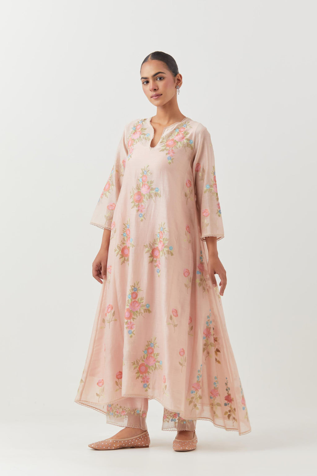 Pink silk chanderi easy fit, asymmetric hem, paneled kurta set with all-over thread embroidered roses, highlighted with scalloped organza at the edges with contrast beads.