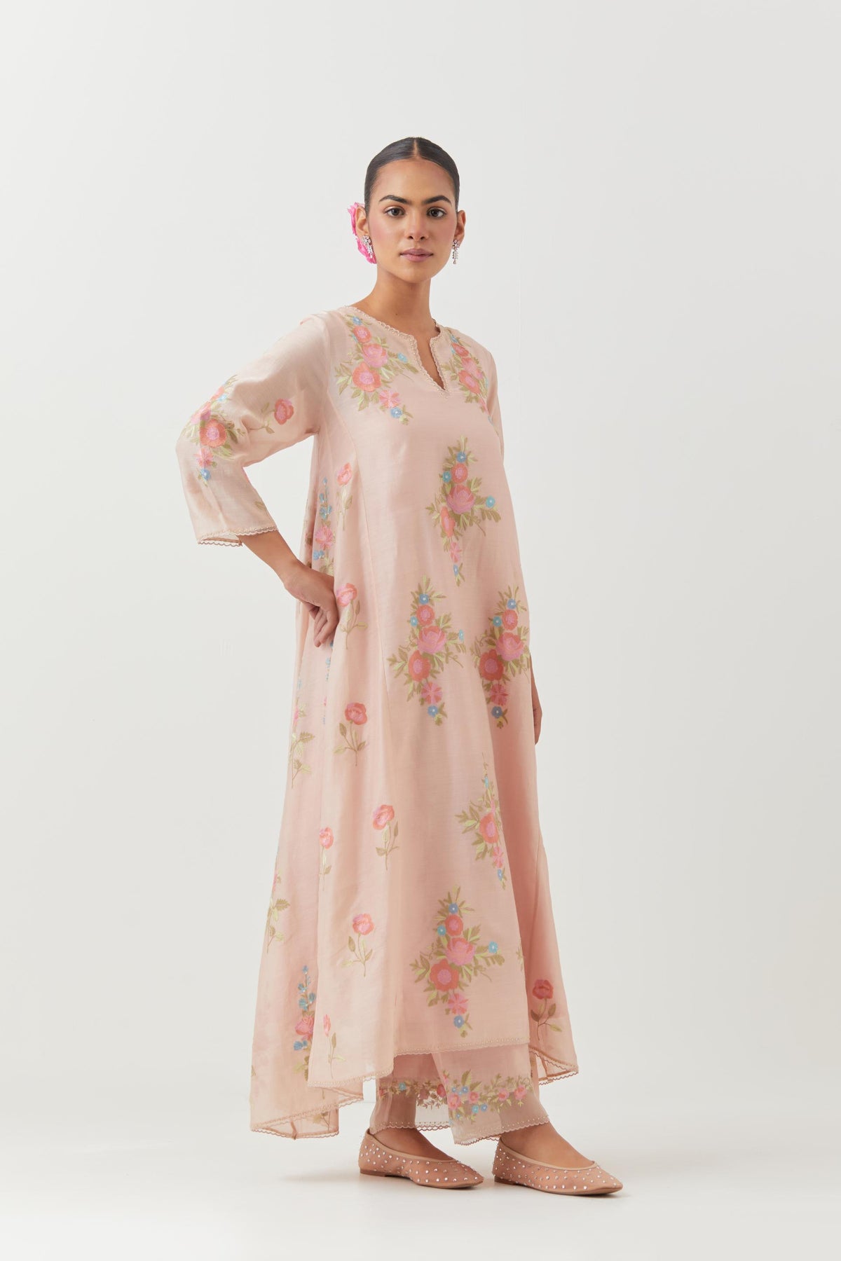 Pink silk chanderi easy fit, asymmetric hem, paneled kurta set with all-over thread embroidered roses, highlighted with scalloped organza at the edges with contrast beads.