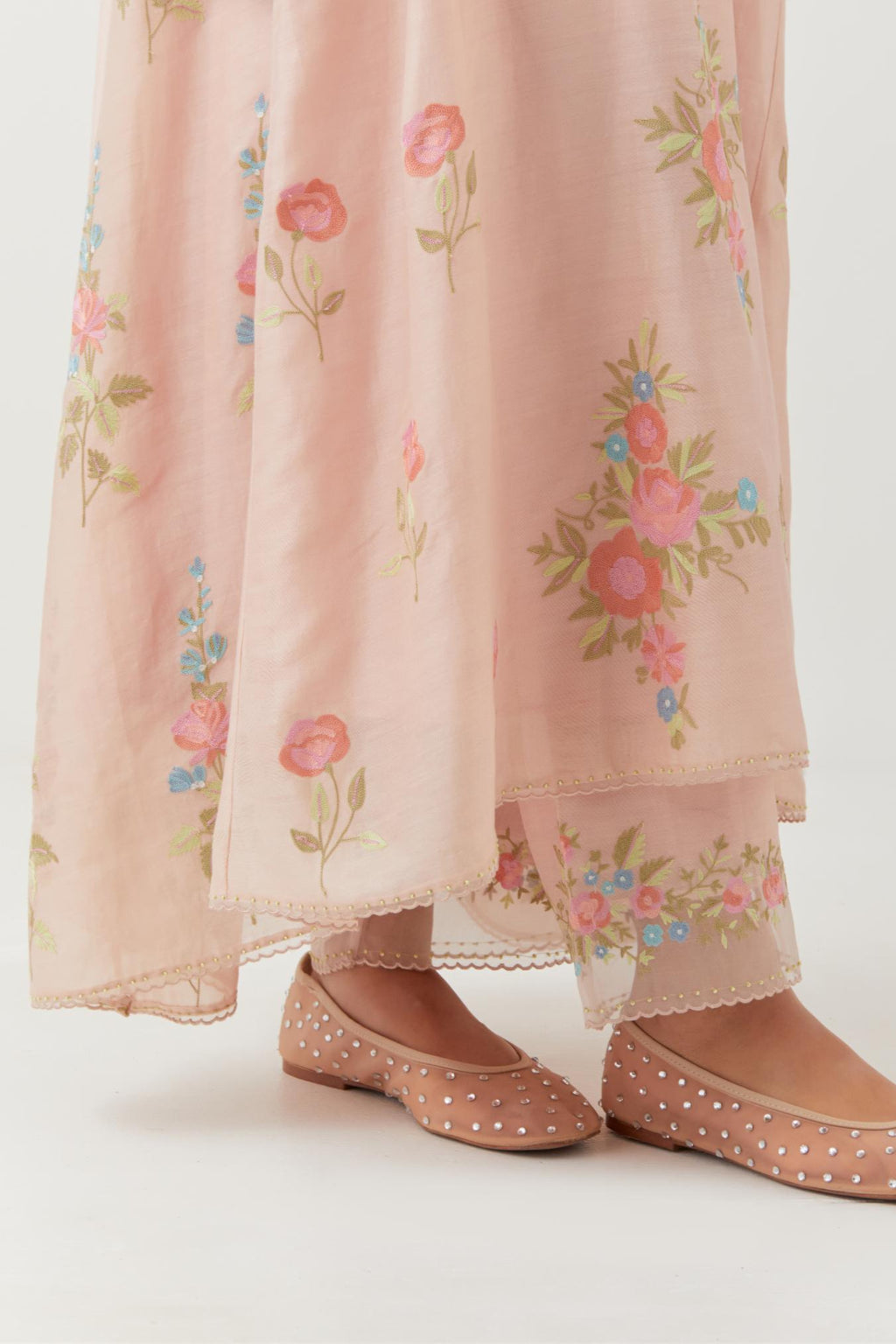 Pink silk chanderi easy fit, asymmetric hem, paneled kurta set with all-over thread embroidered roses, highlighted with scalloped organza at the edges with contrast beads.