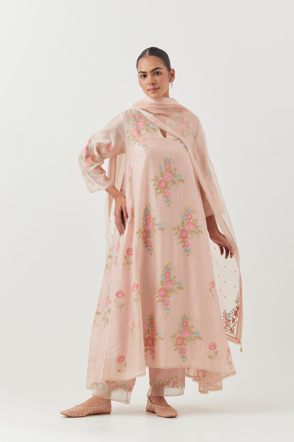 Pink silk chanderi easy fit, asymmetric hem, paneled kurta set with all-over thread embroidered roses, highlighted with scalloped organza at the edges with contrast beads.