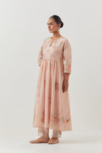Pink silk chanderi Kurta dress set with all-over assorted thread embroidery floral bunches.