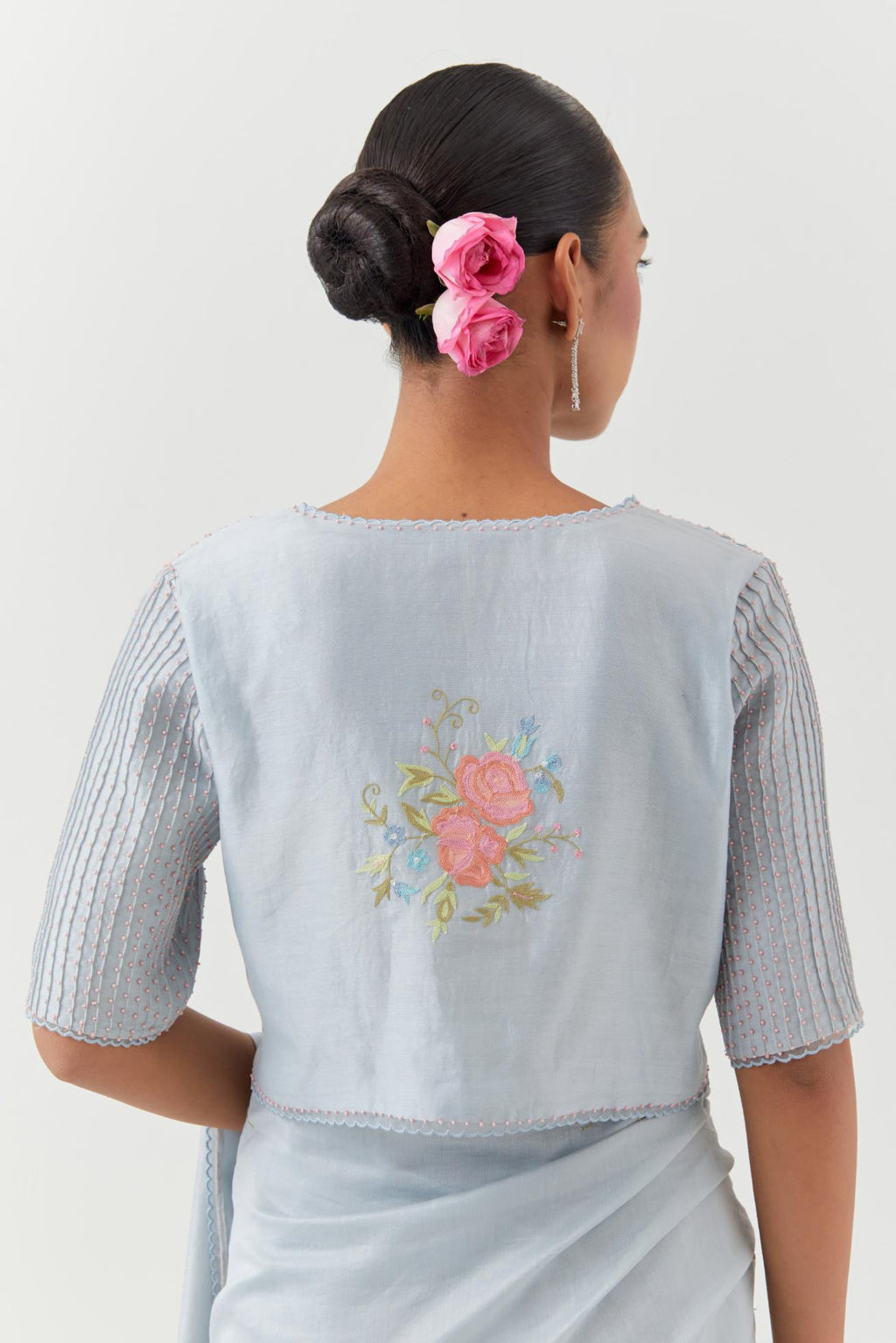 Blue silk chanderi blouse with pin tucks, highlighted with bead work.