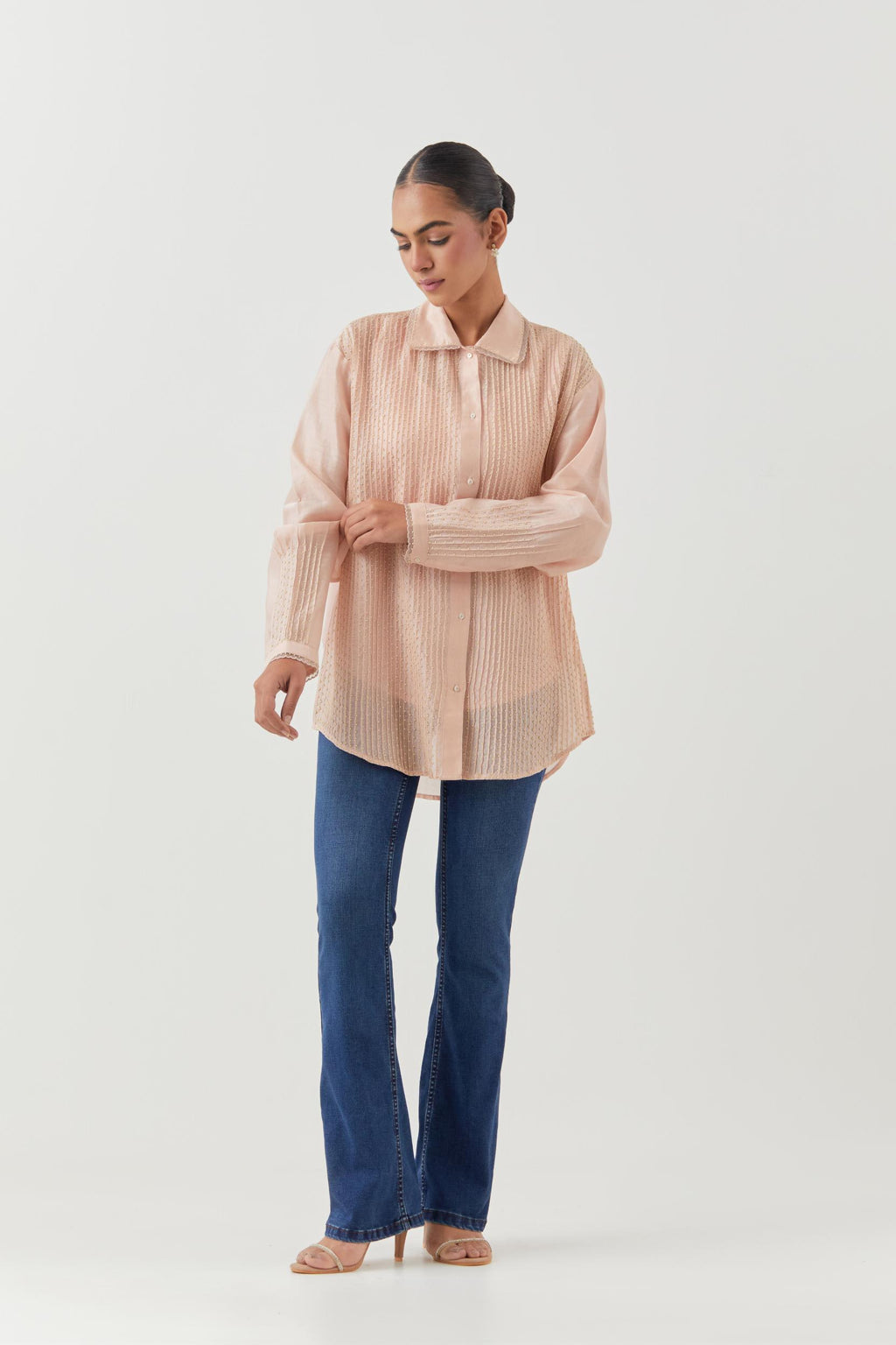 Pink silk chanderi shirt with all-over pin tucks, highlighted with contrast beads in the front.