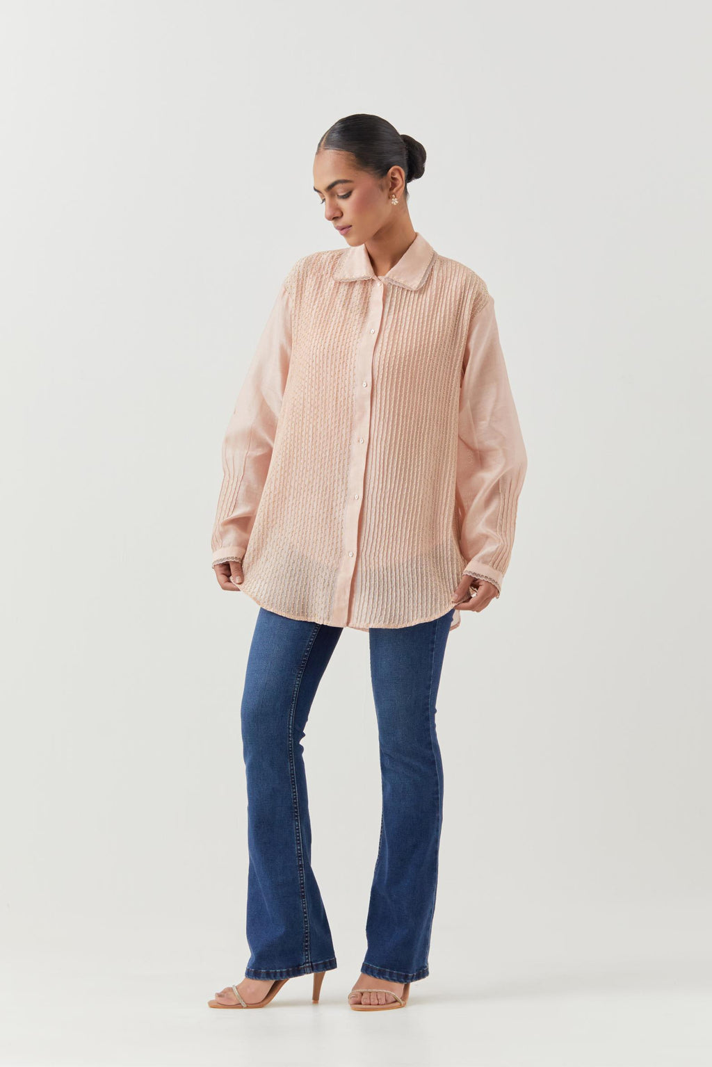 Pink silk chanderi shirt with all-over pin tucks, highlighted with contrast beads in the front.