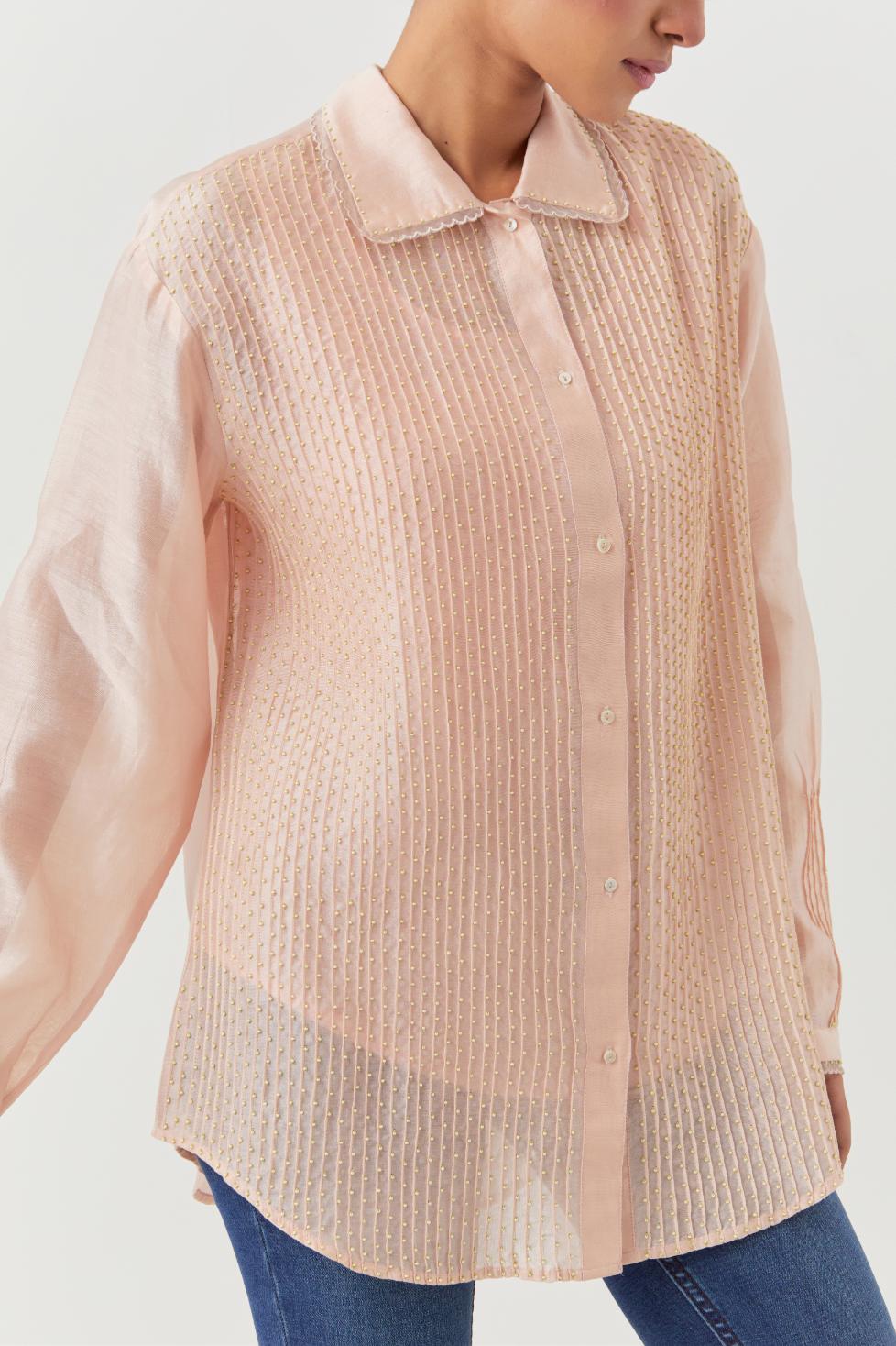 Pink silk chanderi shirt with all-over pin tucks, highlighted with contrast beads in the front.