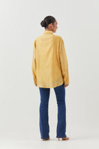Yellow silk chanderi shirt with all-over pin tucks, highlighted with contrast beads in the front.
