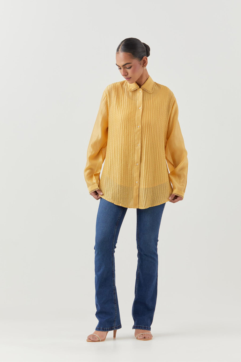 Yellow silk chanderi shirt with all-over pin tucks, highlighted with contrast beads in the front.