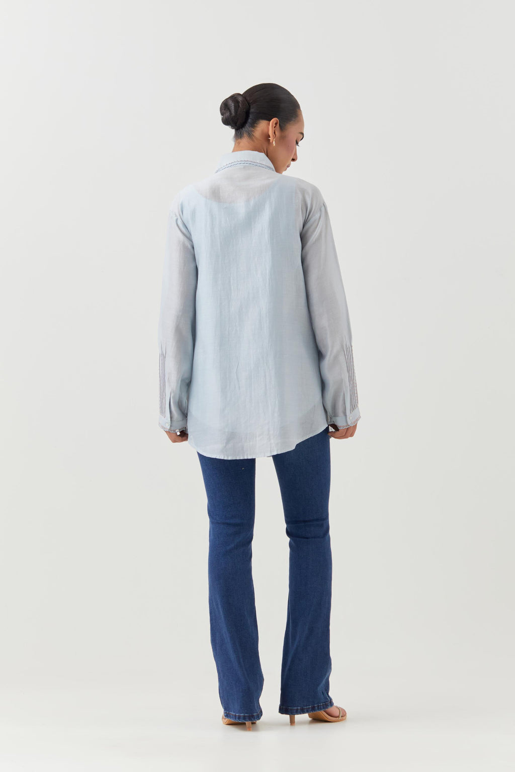 Blue silk chanderi shirt with all-over pin tucks, highlighted with contrast beads in the front.