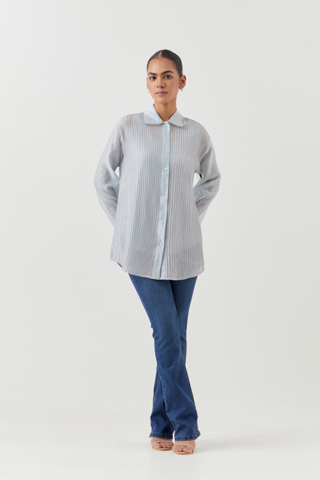 Blue silk chanderi shirt with all-over pin tucks, highlighted with contrast beads in the front.