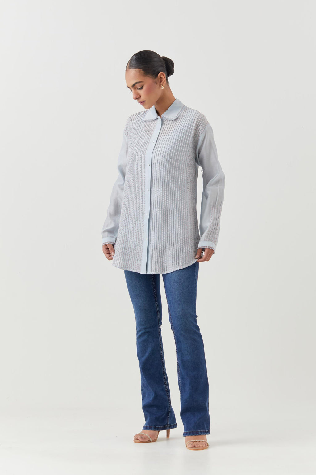 Blue silk chanderi shirt with all-over pin tucks, highlighted with contrast beads in the front.