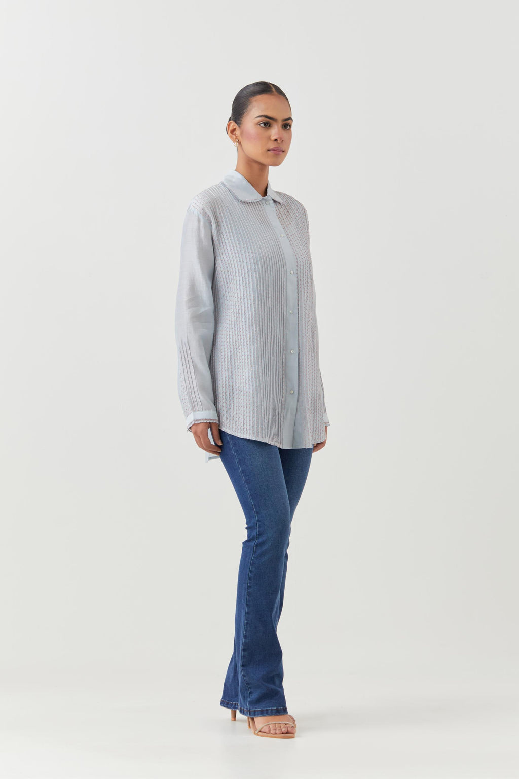 Blue silk chanderi shirt with all-over pin tucks, highlighted with contrast beads in the front.