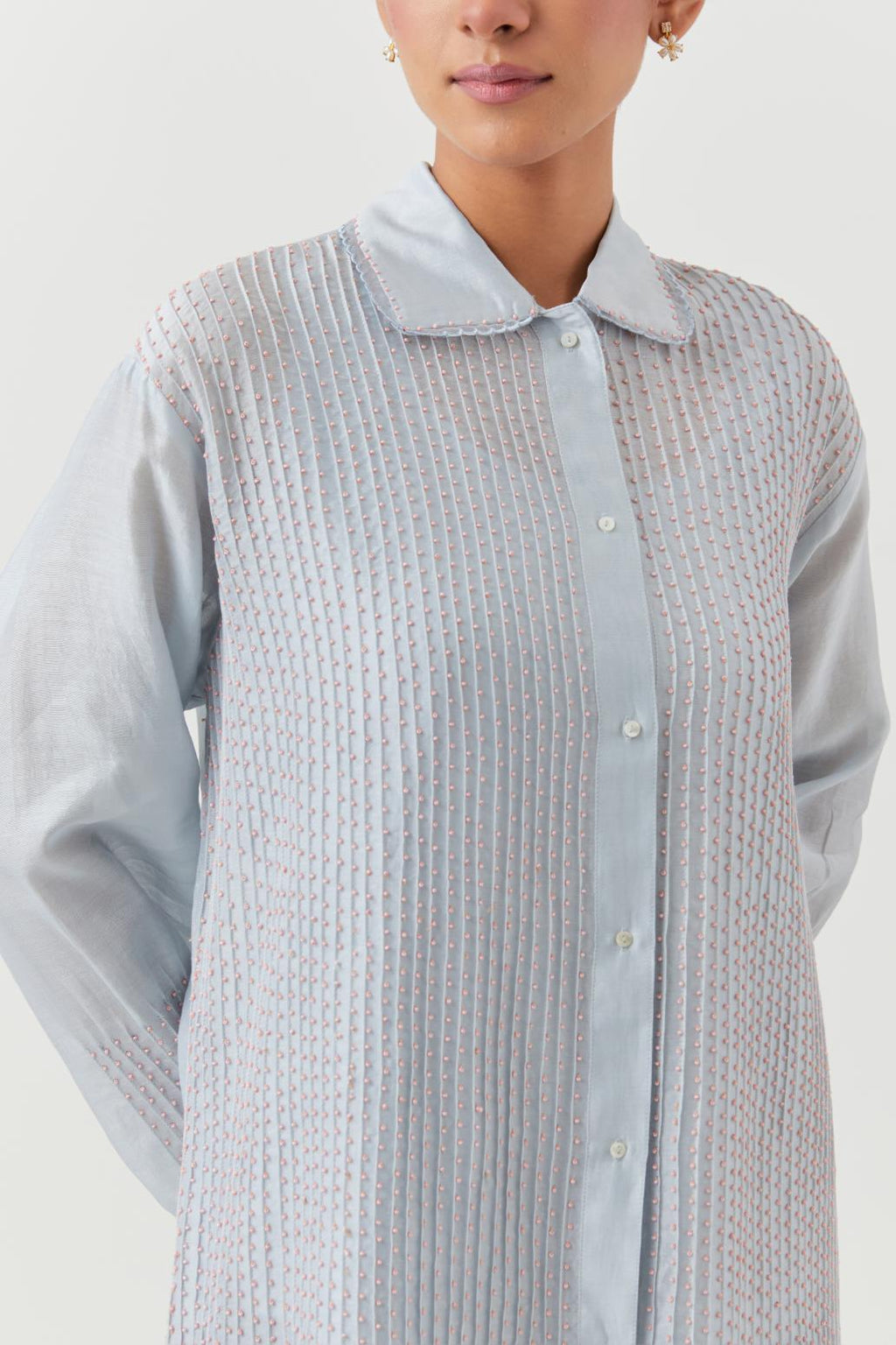 Blue silk chanderi shirt with all-over pin tucks, highlighted with contrast beads in the front.