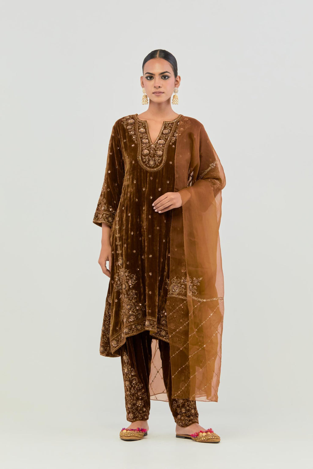 Russet easy fit A-line, paneled, short kurta set in silk velvet with all-over hand embroidery at the neck, sleeves and hem.