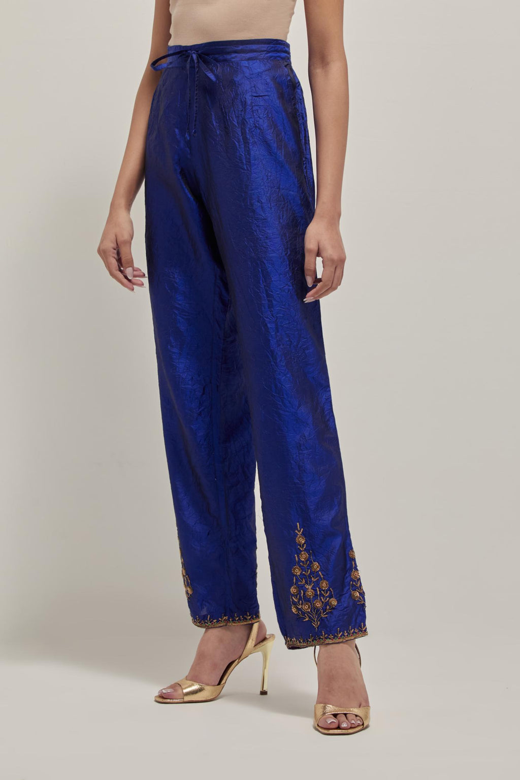 Blue Silk pants, highlighted with hand embroidered bead, sequins and zardozi boota at hem, highlighted with contrast bead work.