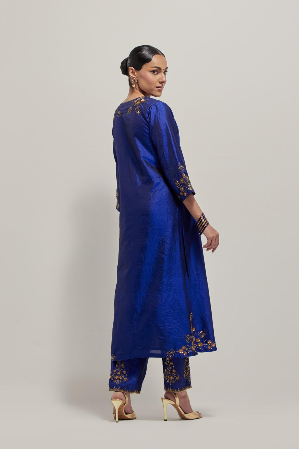 Blue double toned silk straight Kurta set with hand embroidered zardozi and sequins, highlighted with beads.