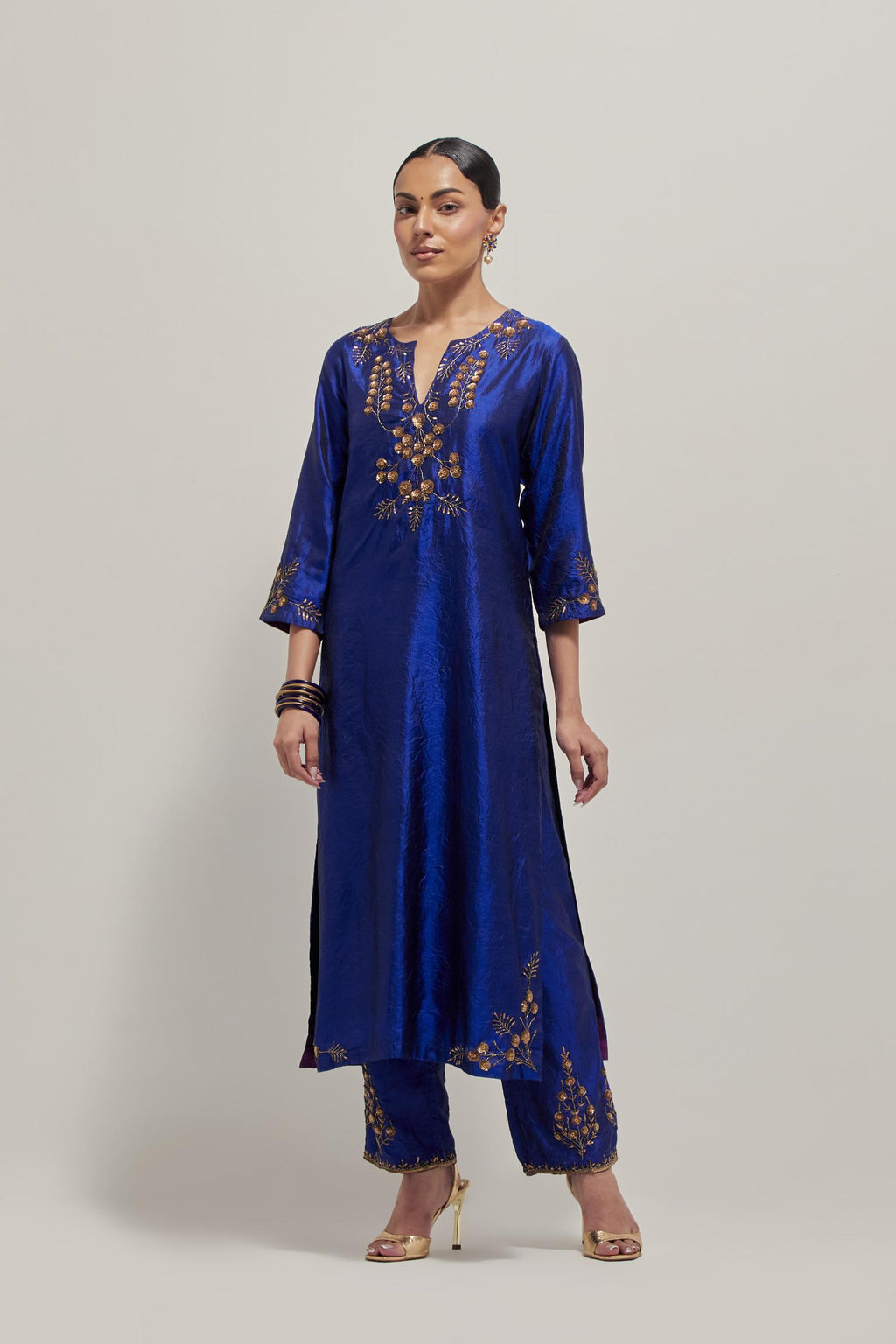 Blue double toned silk straight Kurta set with hand embroidered zardozi and sequins, highlighted with beads.