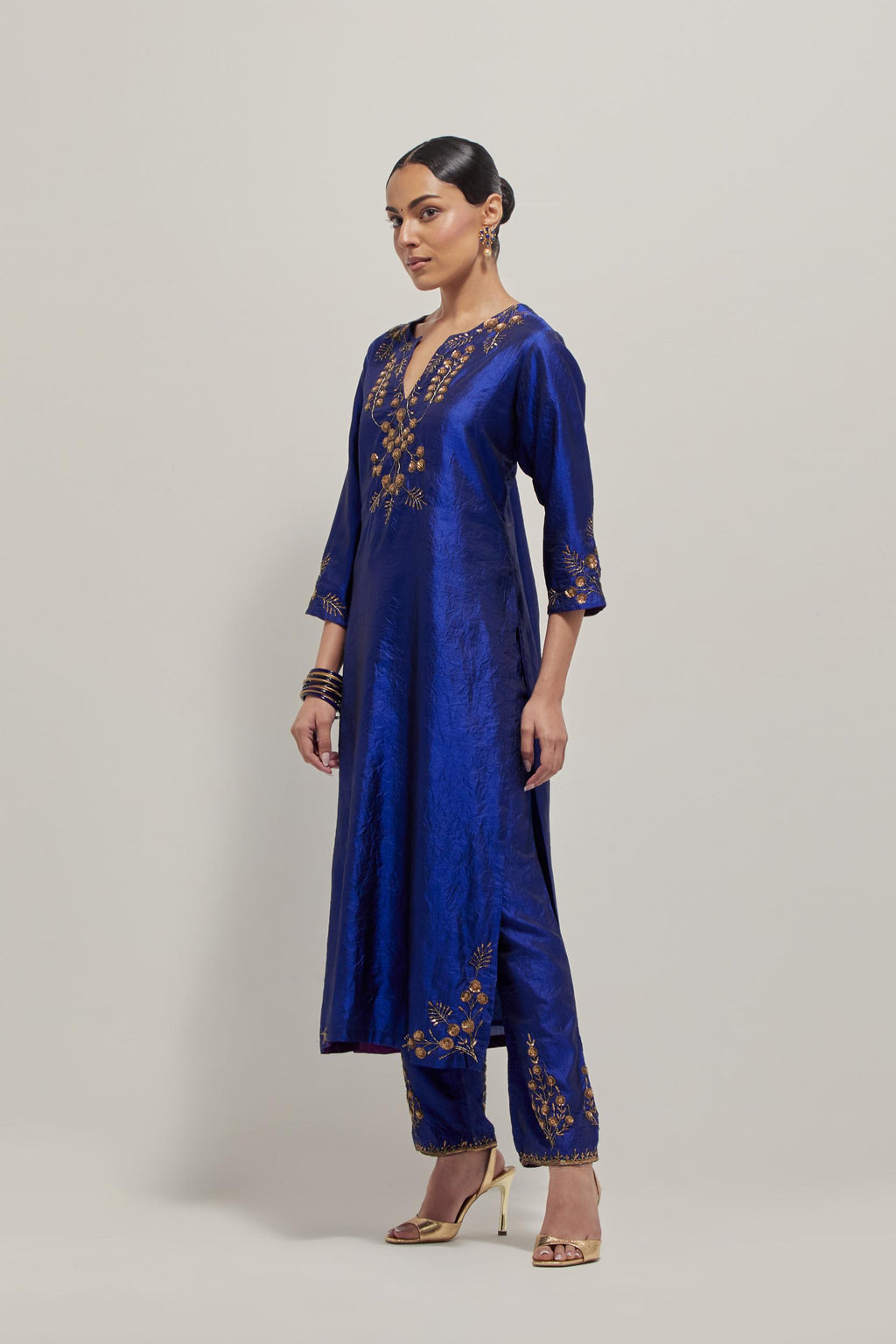 Blue double toned silk straight Kurta set with hand embroidered zardozi and sequins, highlighted with beads.