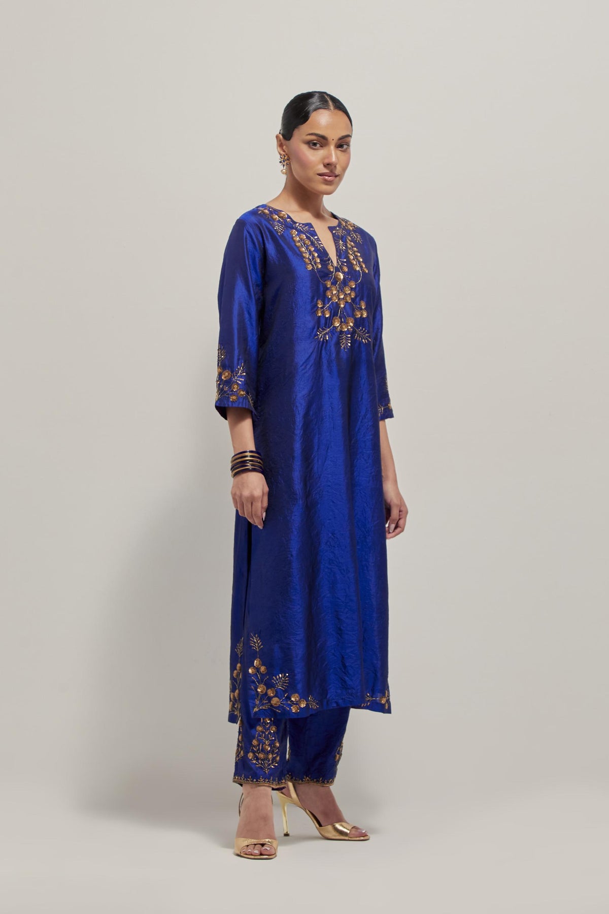 Blue double toned silk straight Kurta set with hand embroidered zardozi and sequins, highlighted with beads.
