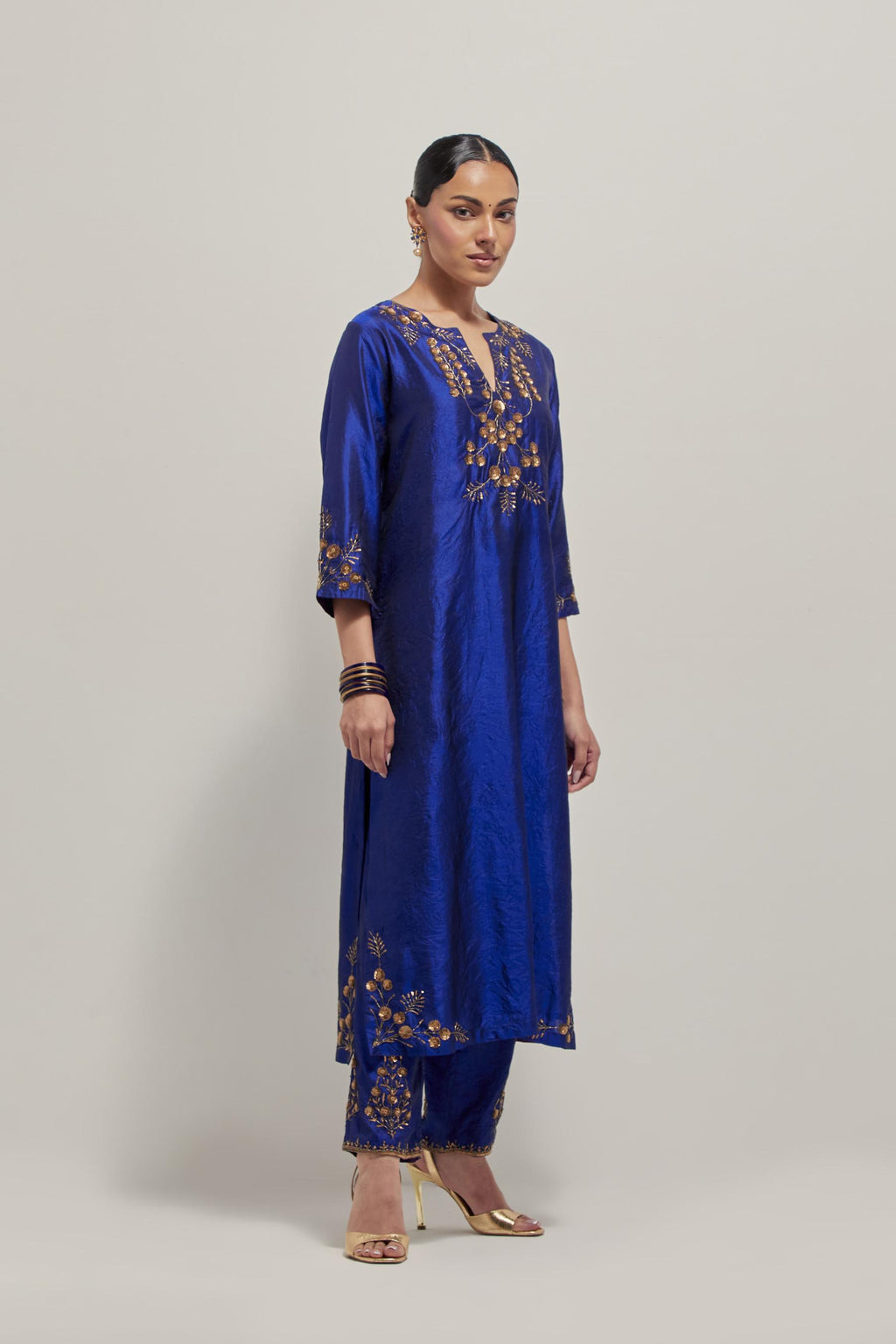 Blue double toned silk straight Kurta set with hand embroidered zardozi and sequins, highlighted with beads.