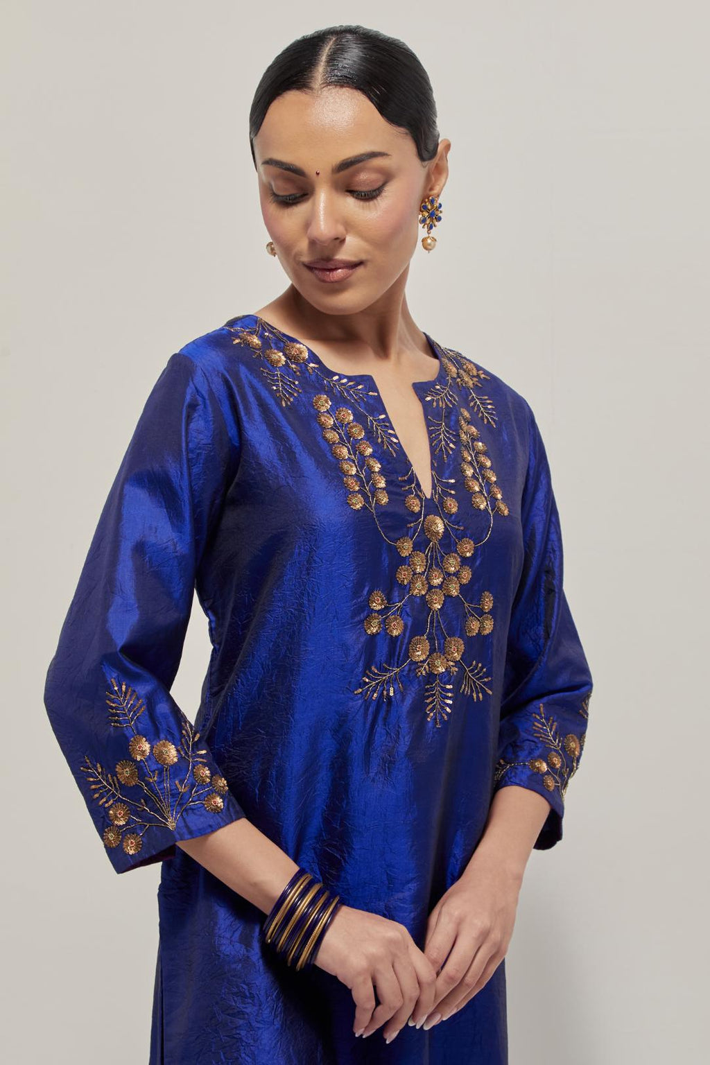 Blue double toned silk straight Kurta set with hand embroidered zardozi and sequins, highlighted with beads.