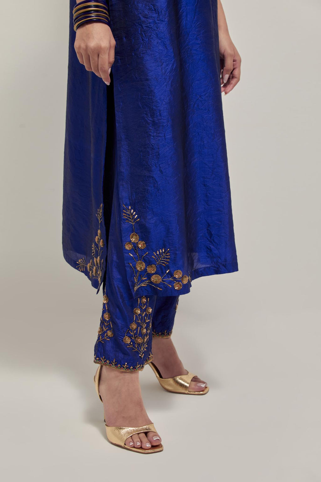 Blue double toned silk straight Kurta set with hand embroidered zardozi and sequins, highlighted with beads.