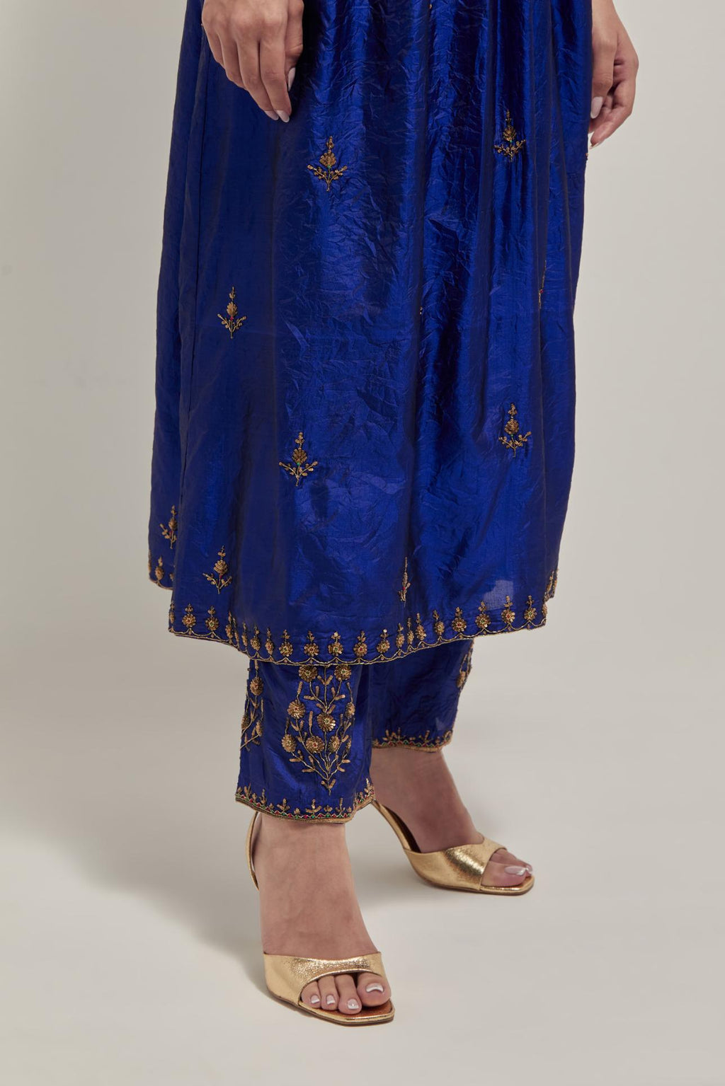 Blue double toned silk kurta set with hand embroidered zardozi and sequins, highlighted with beads.