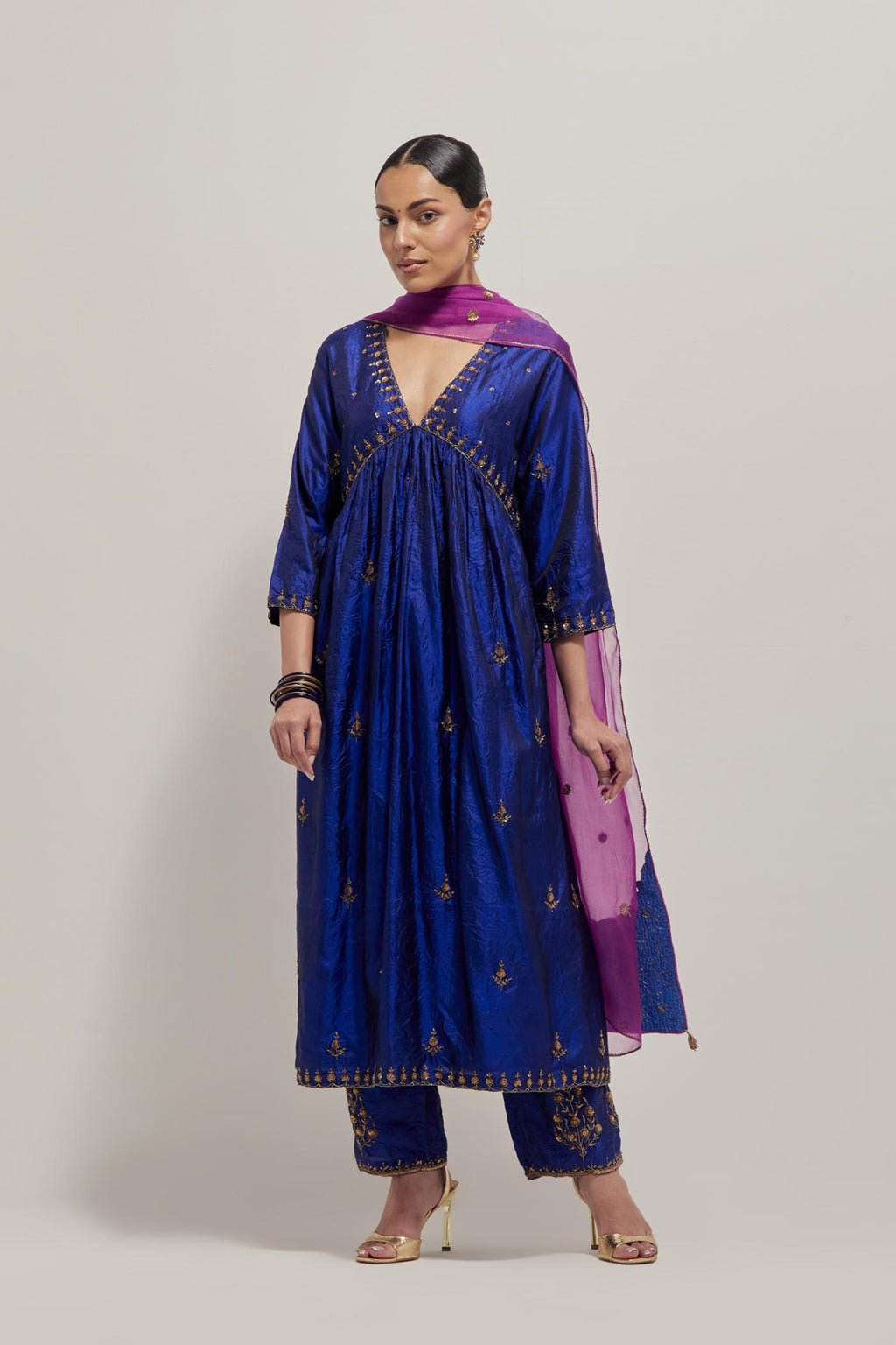 Blue double toned silk kurta set with hand embroidered zardozi and sequins, highlighted with beads.