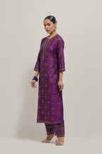 Purple silk straight kurta set with hand embroidered sequins on bandhani inspired floral jaal all-over the kurta, highlighted with contrast-colored beads.