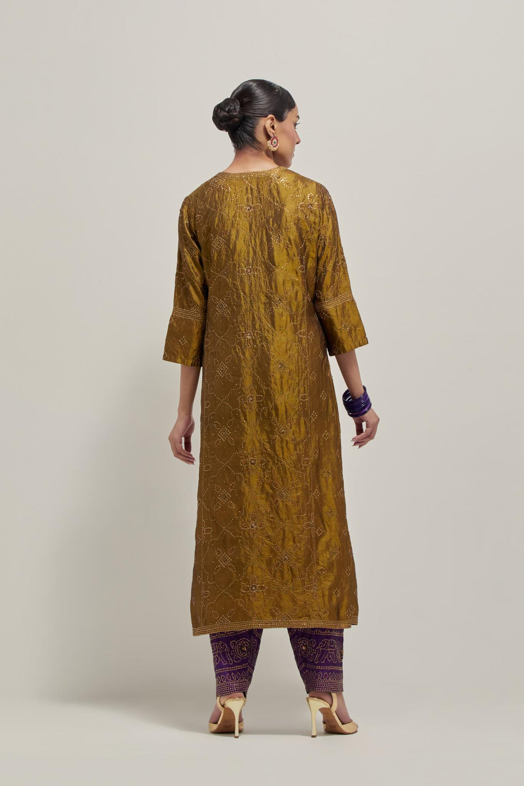 Olive Silk kurta set with all-over hand embroidered sequins on bandhani inspired floral jaal and small square booti at side panels, highlighted with contrast-colored beads.