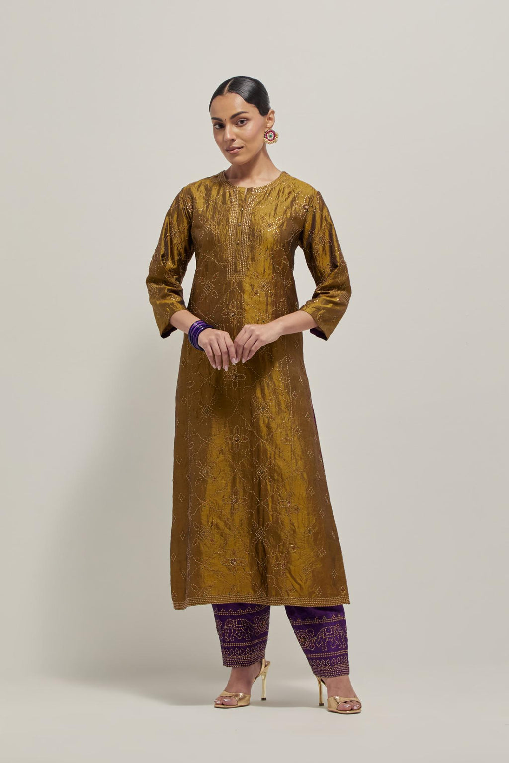 Olive Silk kurta set with all-over hand embroidered sequins on bandhani inspired floral jaal and small square booti at side panels, highlighted with contrast-colored beads.