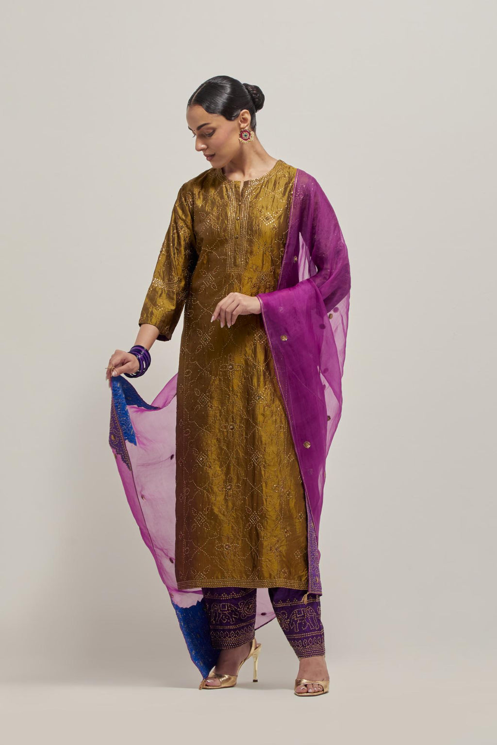 Olive Silk kurta set with all-over hand embroidered sequins on bandhani inspired floral jaal and small square booti at side panels, highlighted with contrast-colored beads.