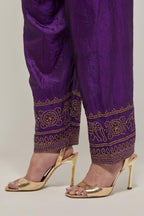 Purple silk narrow salwar with a broad bandhani-inspired border at the hem, detailed with delicate bead and sequin work.
