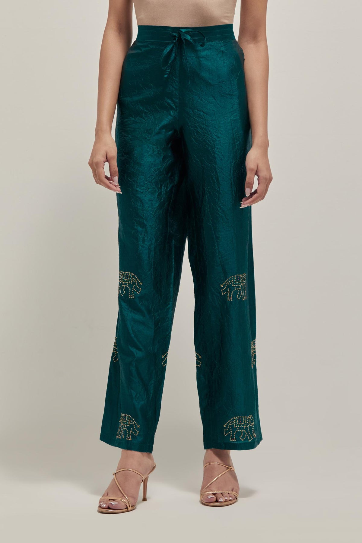 Teal Green silk pants with side pockets and assorted sequined elephants till mid-calf length.