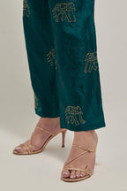 Teal Green silk pants with side pockets and assorted sequined elephants till mid-calf length.
