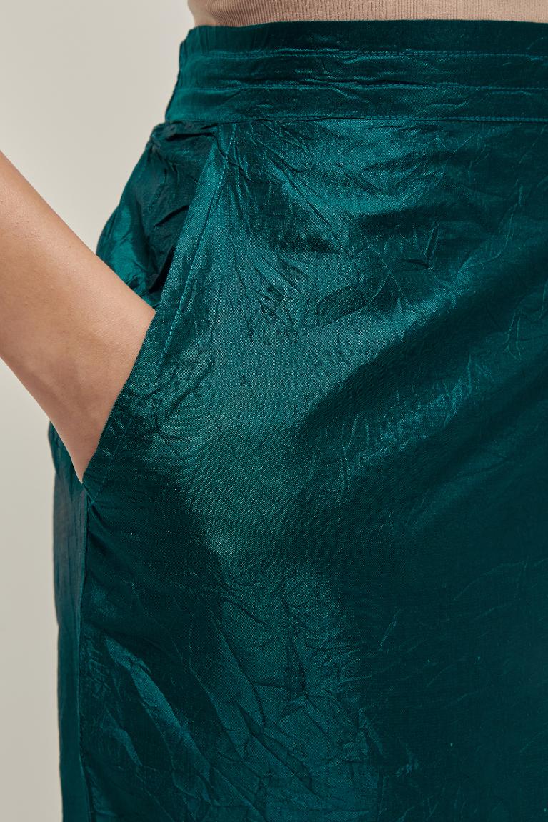 Teal Green silk pants with side pockets and assorted sequined elephants till mid-calf length.