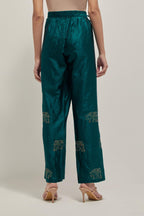 Teal Green silk pants with side pockets and assorted sequined elephants till mid-calf length.