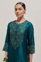 Teal Silk kurta set with hand embroidered sequins on bandhani inspired jaal work at neck, hem and sleeves cuff, highlighted with contrast-colored beads.