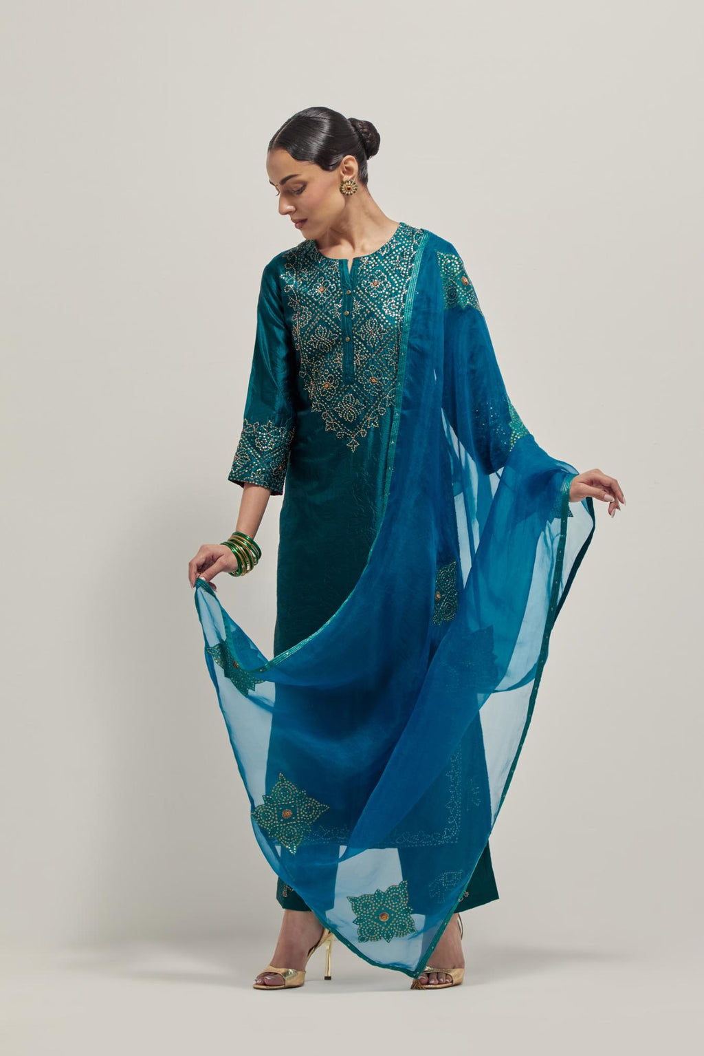 Teal silk organza dupatta with all-over applique bandhani-inspired motifs, highlighted with contrast bead work.